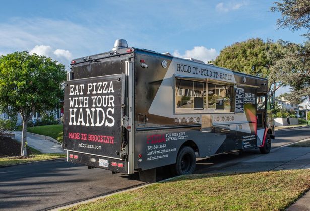 Image of Made In Brooklyn food truck parked next to green lawn